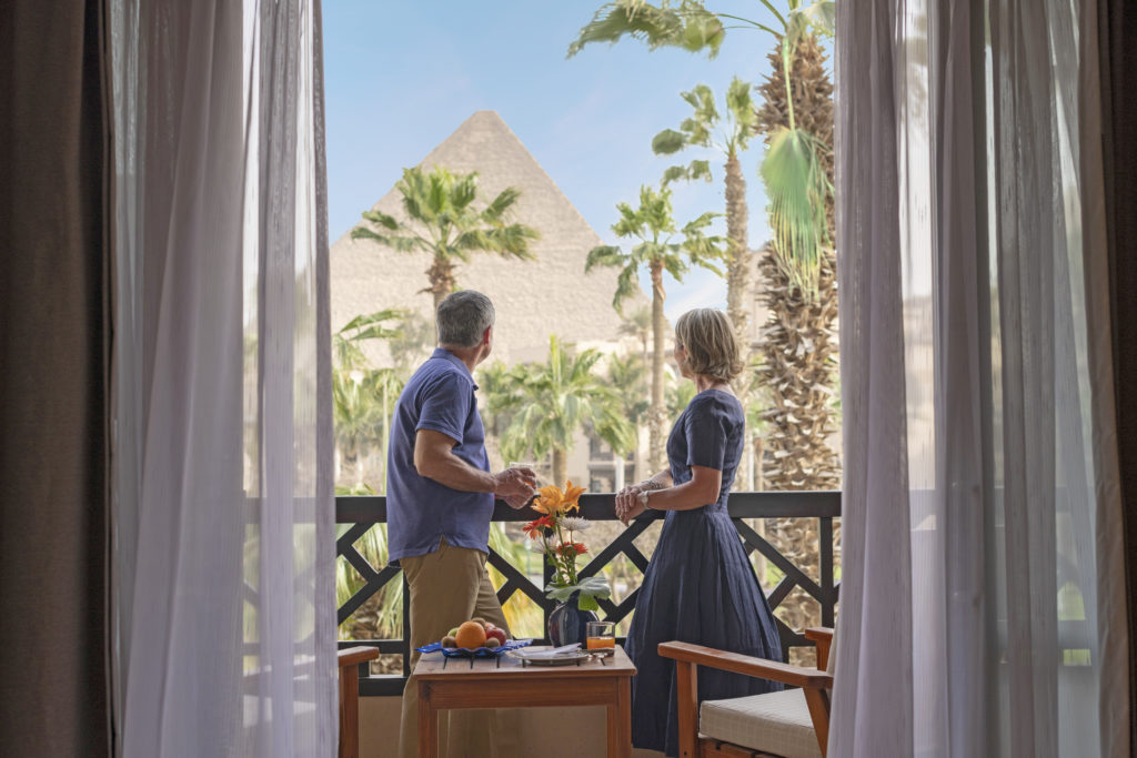 couple looking at pyramids at Mena House Hotel