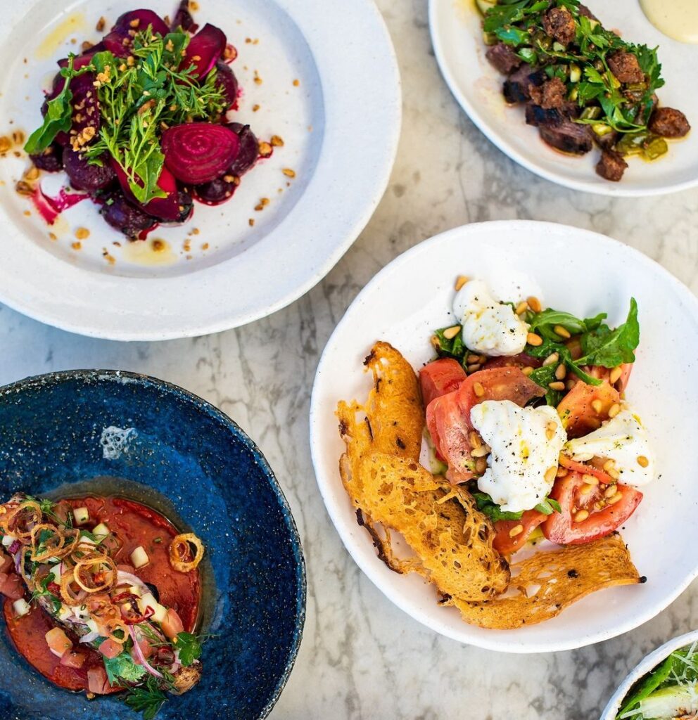 Image of bowls and plates of food, taken overhead