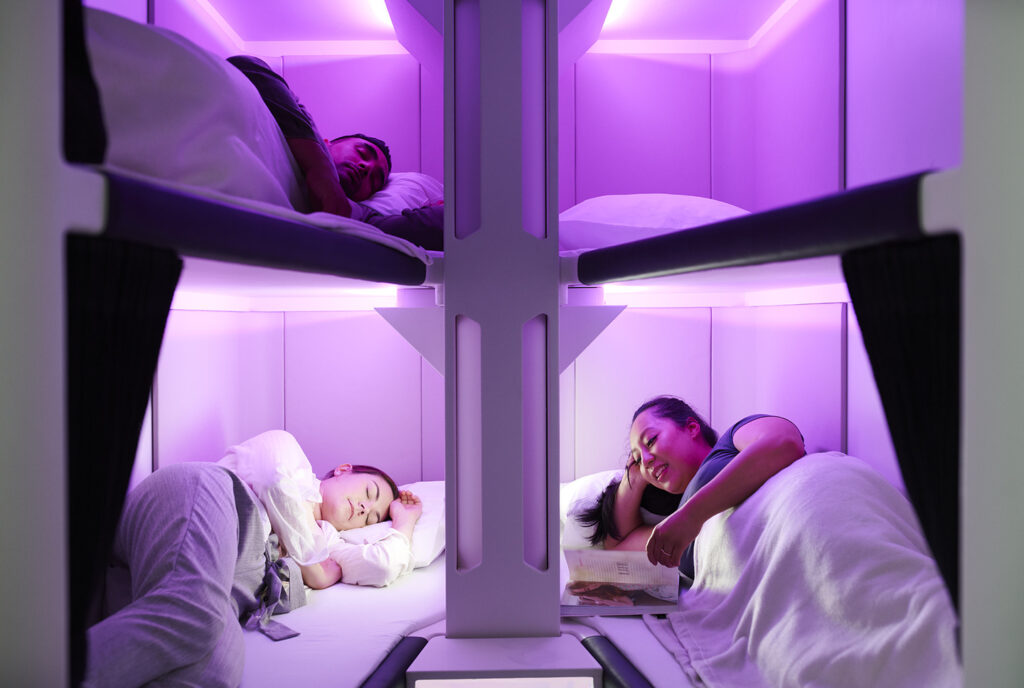 Air New Zealand Skynest with people laying in bunks