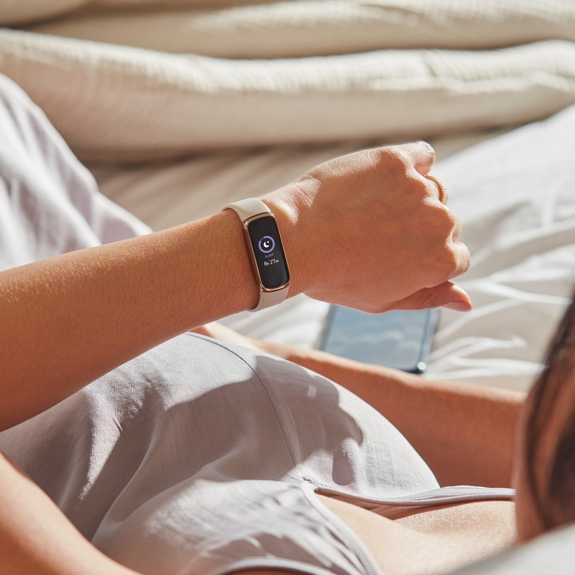 woman wearing Fitbit Luxe