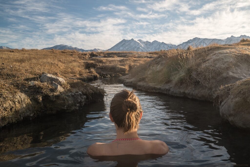 woman soaking in hot springs 