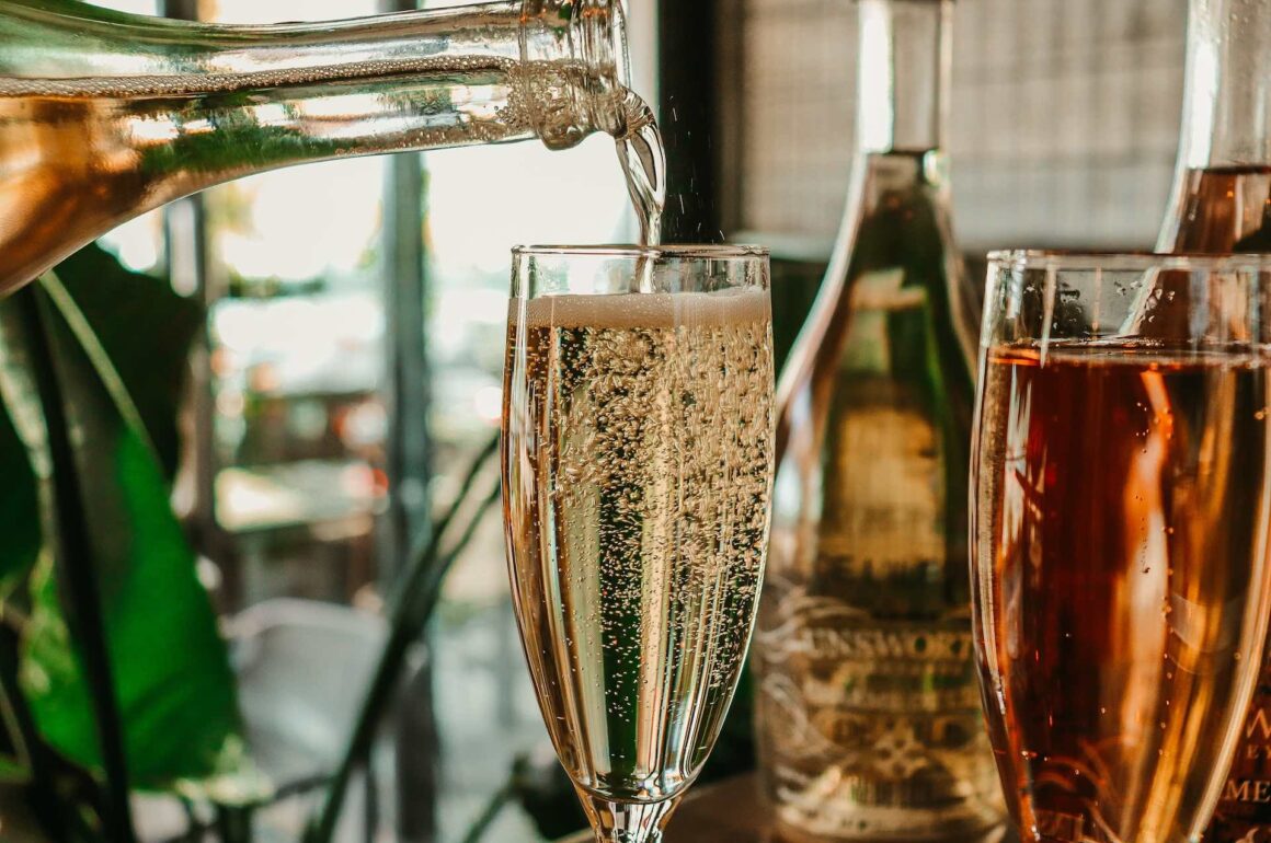 Close up of sparking wine being poured in to glass