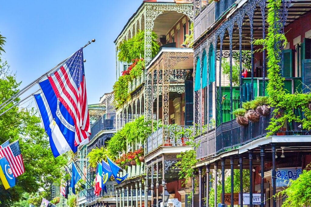 American flags, and balconies covered with greenery in New Orleans, USA.