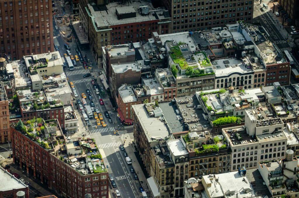 Aerial view looking down at rooftops of a city block